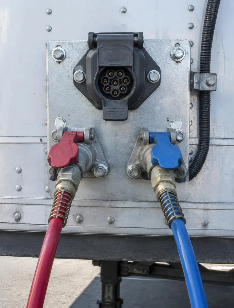 7-pin connector and air line fittings on a trailer